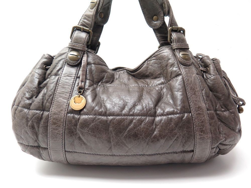 sac a main gerard darel 36 h en cuir vielli marron