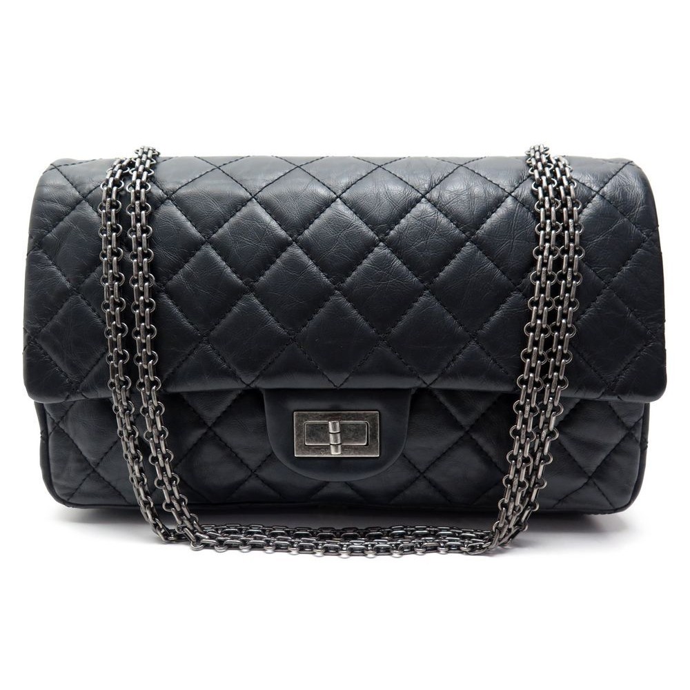 Black quilted bag with golden shoulder strap