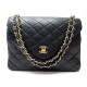 VINTAGE SAC A MAIN CHANEL EN CUIR MATELASSE NOIR NUMERO 0265302 