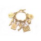 BRACELET CHANEL A BRELOQUES TREFLE SAC TIMELESS TORTUE CHARMS CAMELIA METAL DORE 