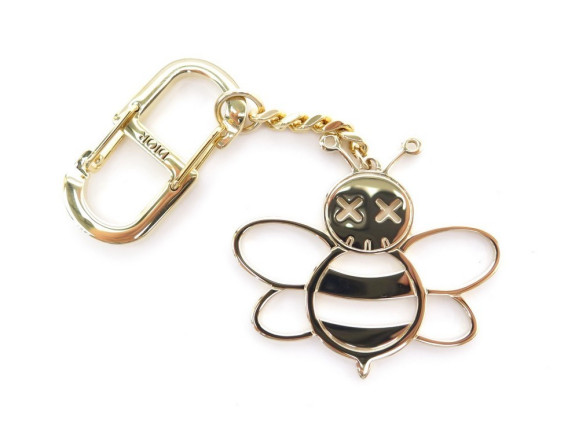 porte cle christian dior x kaws bee en metal dore