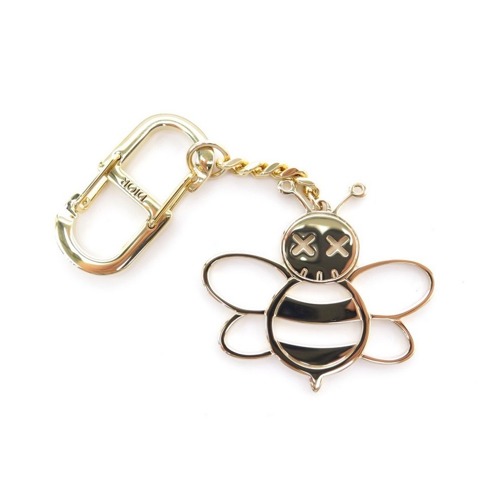 porte cle christian dior x kaws bee en metal dore