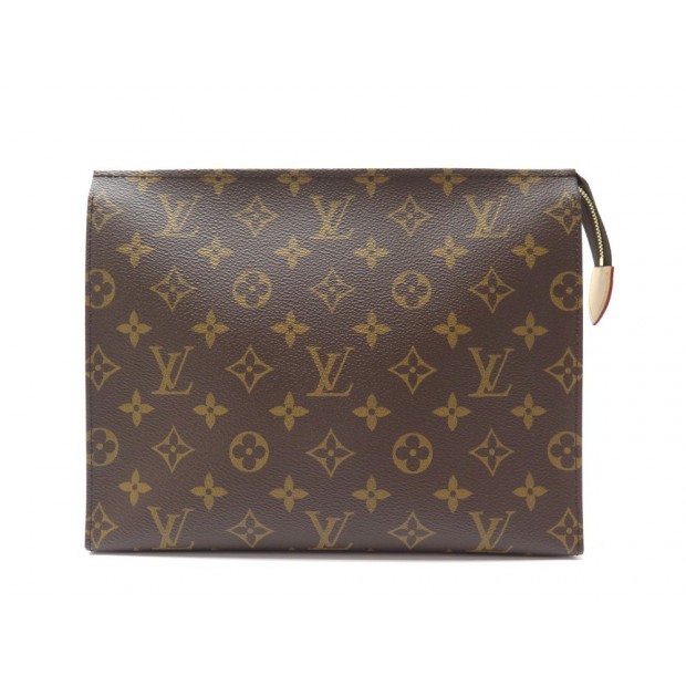 LOUIS VUITTON. Petite valise souple en toile monogram et…