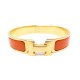 BRACELET HERMES CLIC H H700001F 17 CM EN EMAIL ORANGE ET PLAQUE OR + BOITE 555€