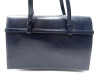 a main christian dior en cuir box bleu circa