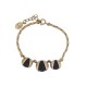 BRACELET CHRISTIAN DIOR TRIBALE 16 A 19 CM EN METAL DORE ET PERLES NOIRES 450€