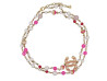 collier sautoir chanel perles roses et logo cc