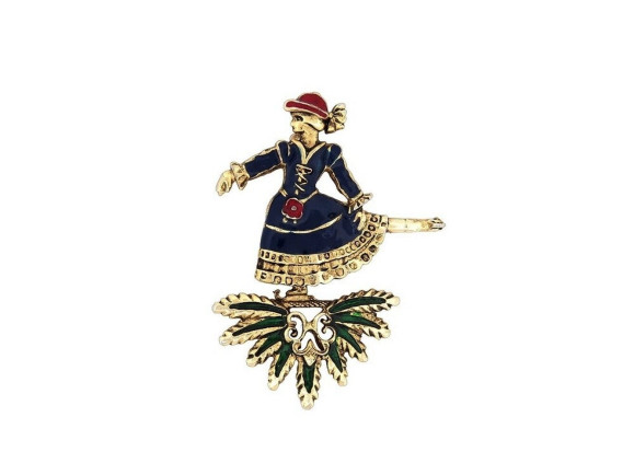 broche hermes patineuse en metal dore et email