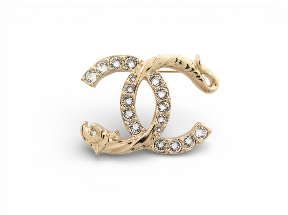 broche chanel logo cc dragon strass en metal dore