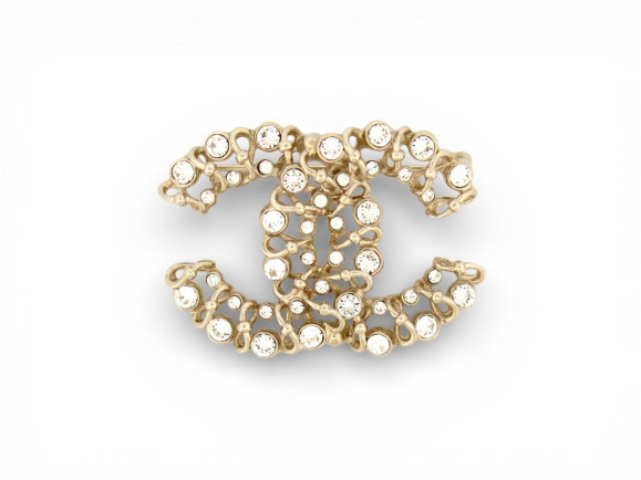  broche chanel logo cc ajoure strass en metal dore