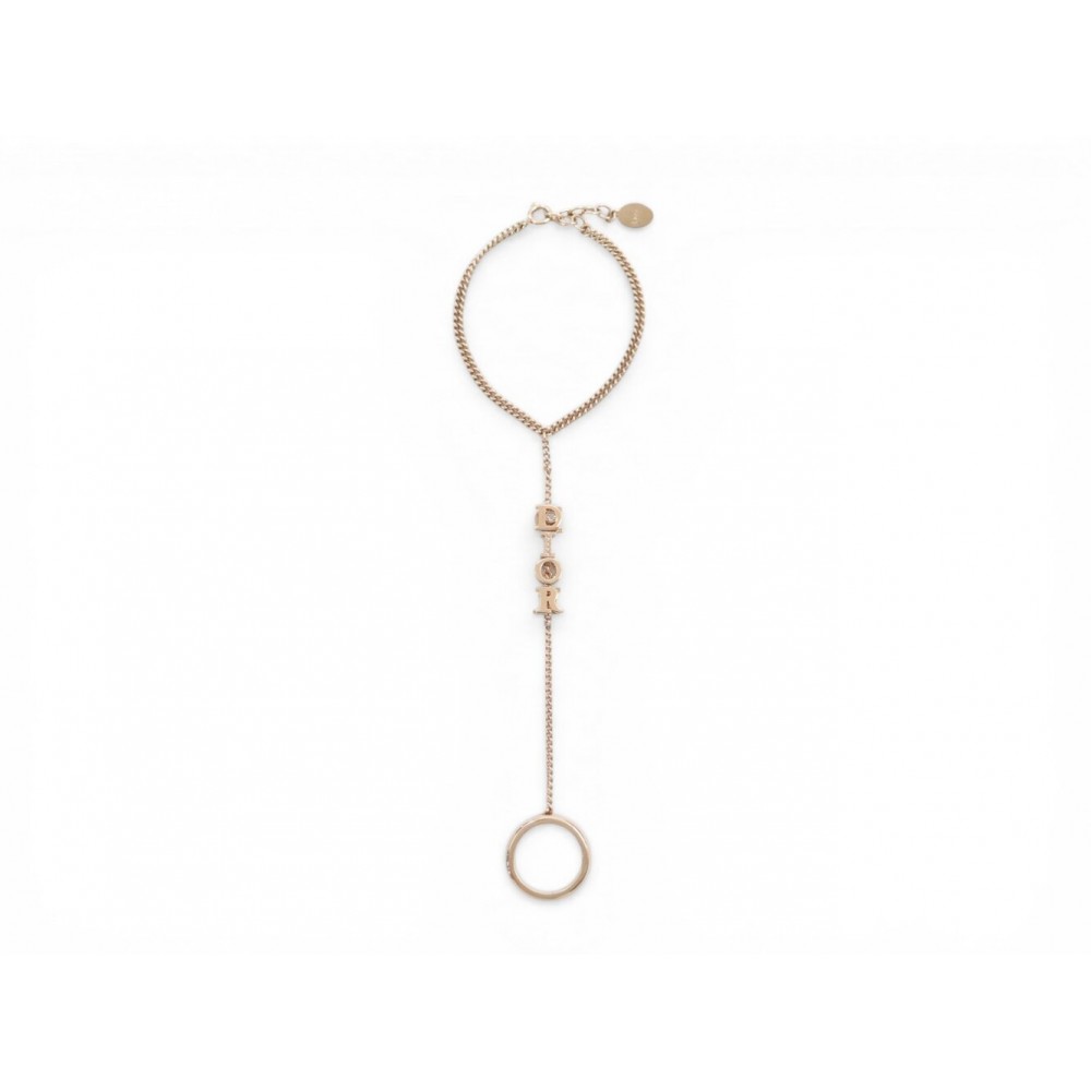 NEUF BAGUE BRACELET CHRISTIAN DIOR BAGUE BRACELET CHARMS LOGO EN METAL DORE 500€
