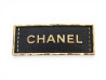 broche chanel plaque logo cuir metal dore leather