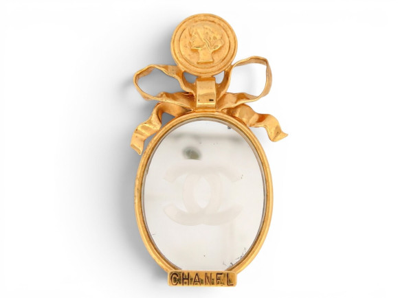  broche chanel miroir avec noeud portrait coco